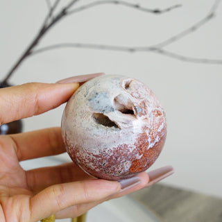 Ocean Jasper sphere with druzy pockets