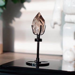 Faceted Smoky Quartz Flame on Black Metal Spinning Stand